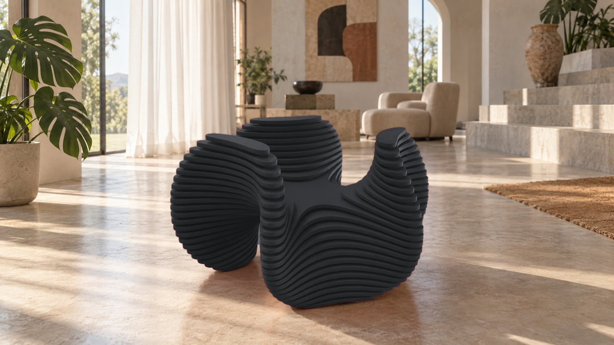 Parametric Bloom Table in charcoal, layered four-lobed low accent table